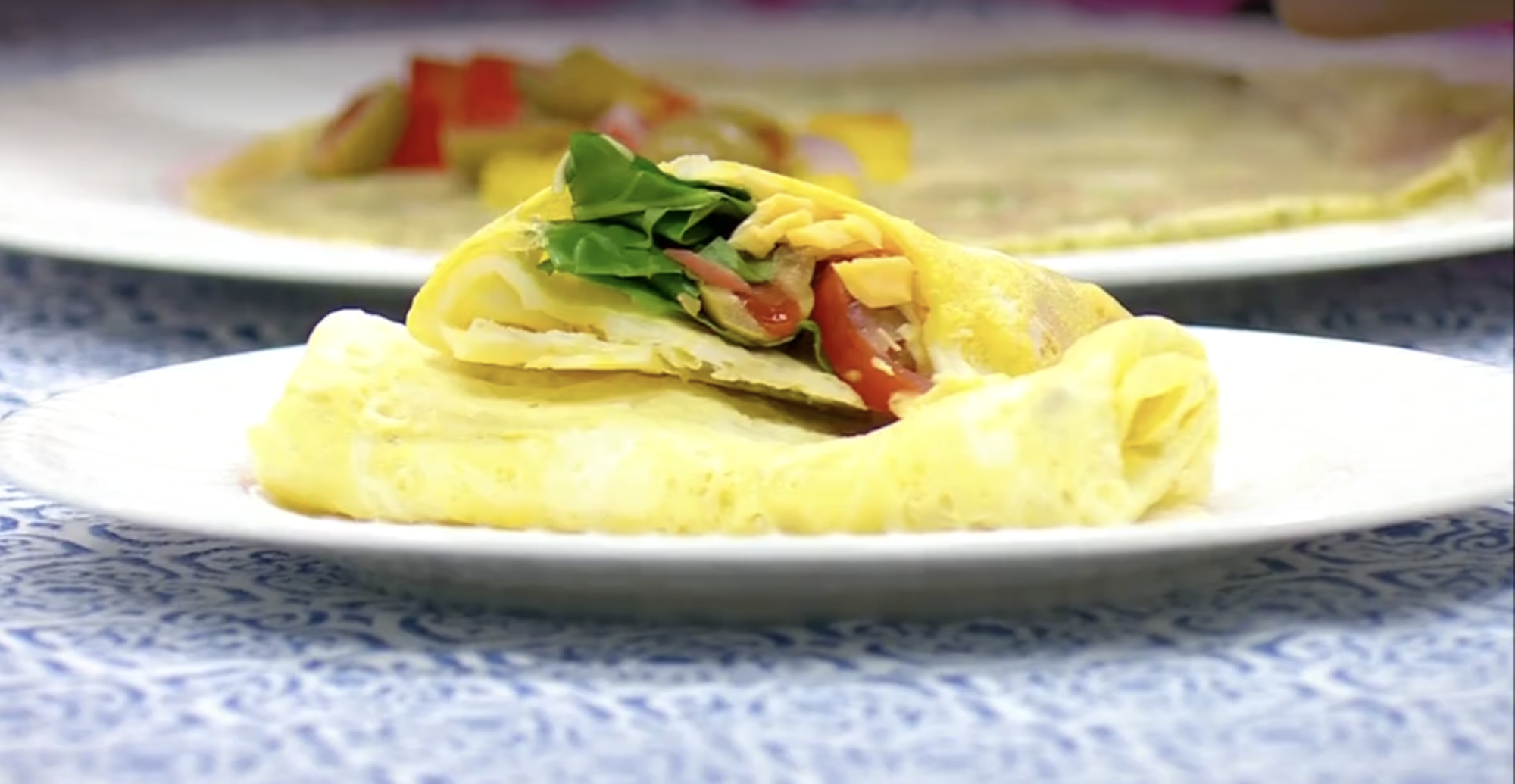 A simple egg wrap filled with turkey, cheese, and veggies. A quick and healthy breakfast idea, perfect for busy mornings.